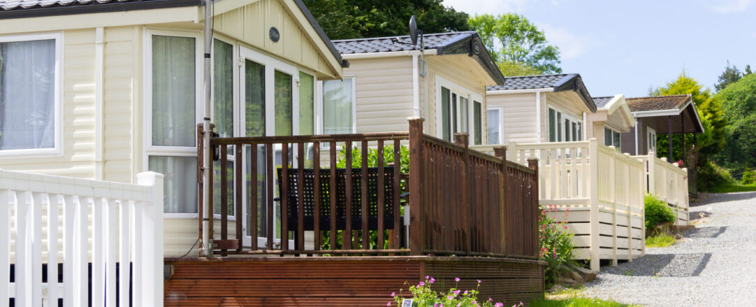 Row of static mobile homes on caravan site in rural Wales, places where people come to relax and vacation away from the stresses of the world.